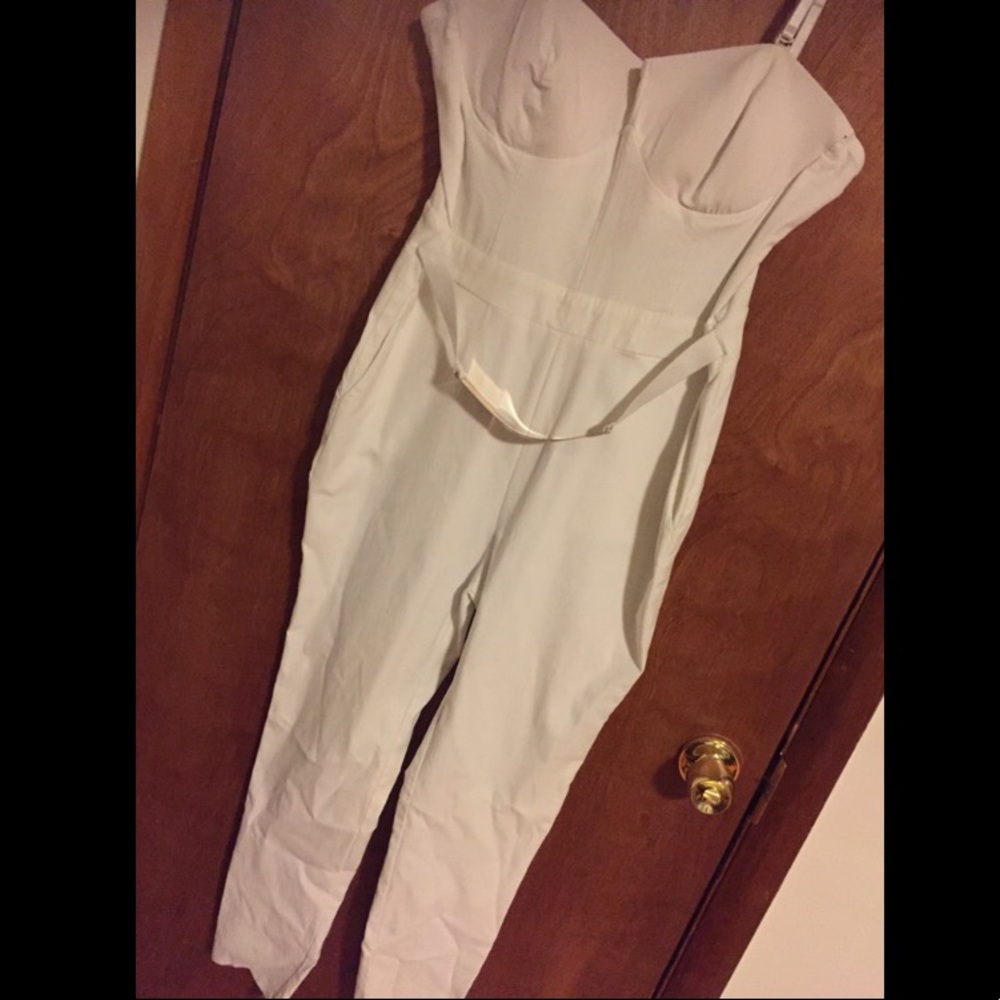 White jumper with gold waist belt